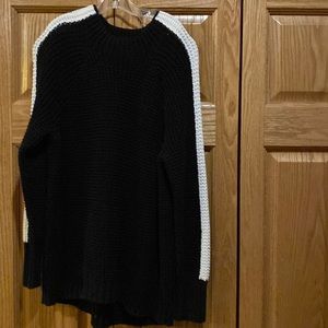 Victoria’s Secret Black and Cream sweater in size medium.